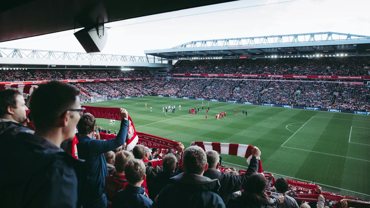Supporters watch a football match from the stands during 2026 FIFA World Cup qualifying