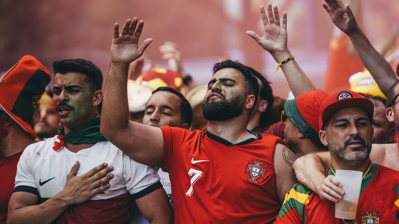 Two players battle for the ball during a football match in 2026 FIFA World Cup qualifying coverage